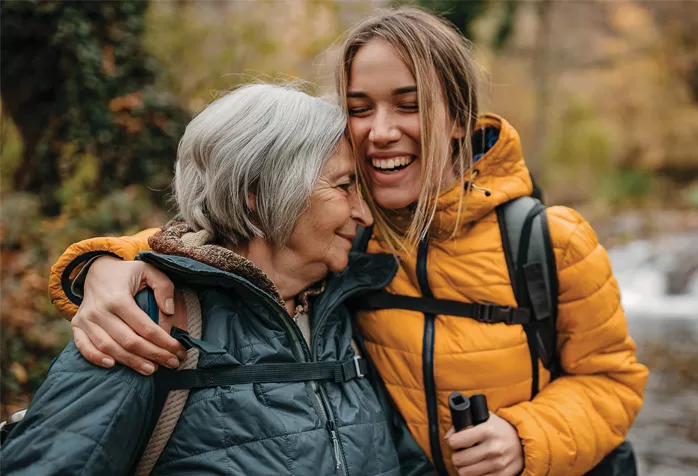 Two people embracing, smiling Two people embracing, smiling