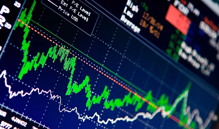 Close-up of a stock trading screen with green and white price lines. Close-up of a stock trading screen with green and white price lines.