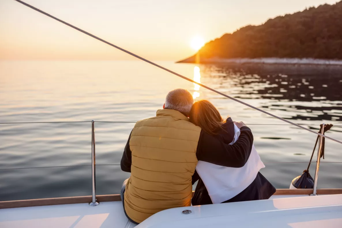  An old couple watching a distant sunset
